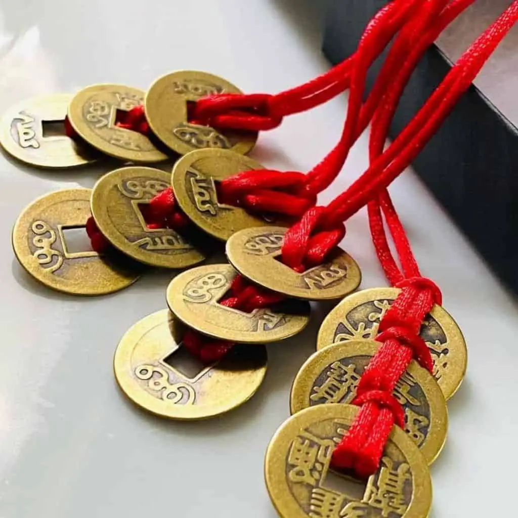 Feng shui coins with red ribbons