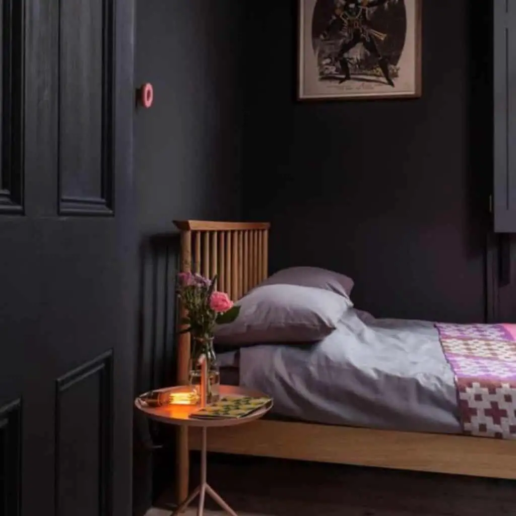 Minimalistic bedroom with dark and calming colour palette